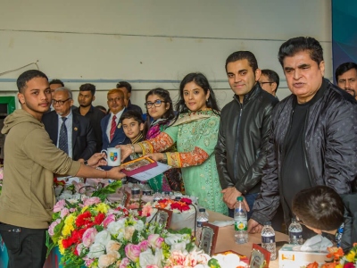 1_Ms.-Yasna-Puja-Iqbal-Member-BoT-SHUST-giving-Certificate-Crest-to-the-Student-in-the-Reception-Program